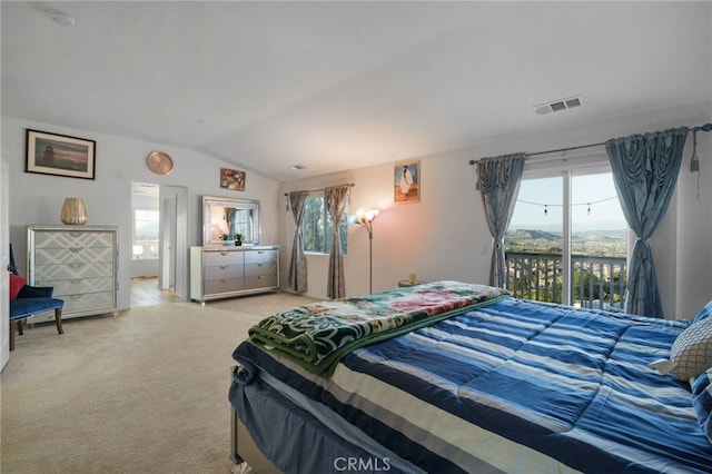 bedroom featuring visible vents, multiple windows, access to outside, carpet flooring, and lofted ceiling