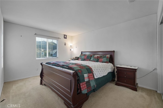 bedroom with carpet flooring and baseboards