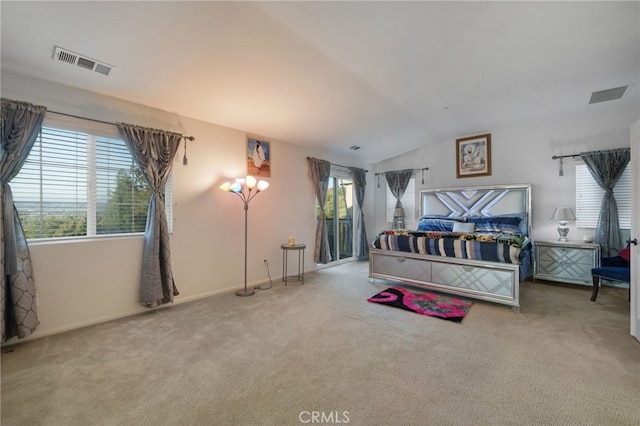 bedroom featuring visible vents, baseboards, carpet flooring, and vaulted ceiling