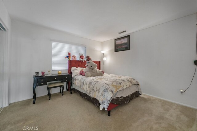 bedroom with visible vents and carpet floors