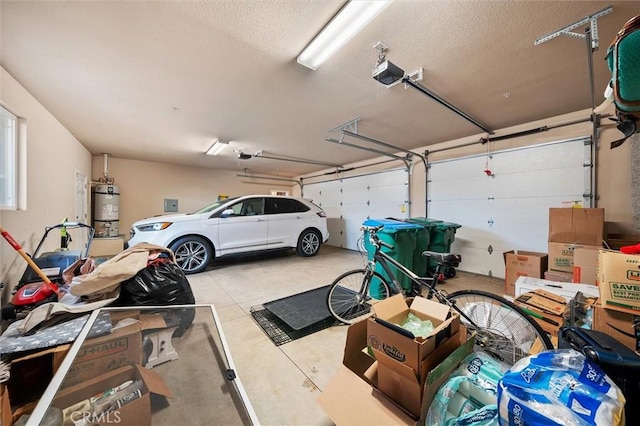 garage featuring secured water heater and a garage door opener