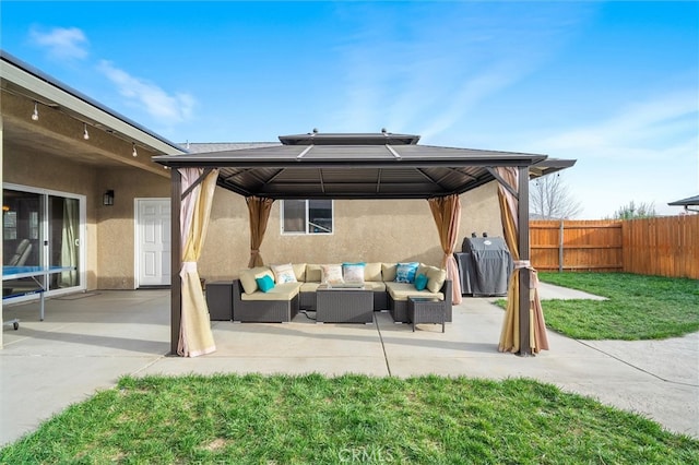 view of patio with a gazebo, area for grilling, outdoor lounge area, and fence