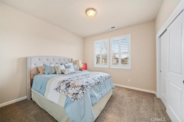 bedroom featuring visible vents, carpet floors, and baseboards