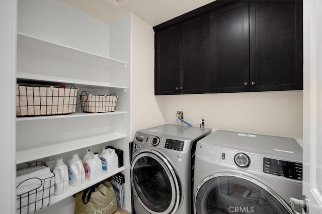 laundry area with washer and dryer and cabinet space