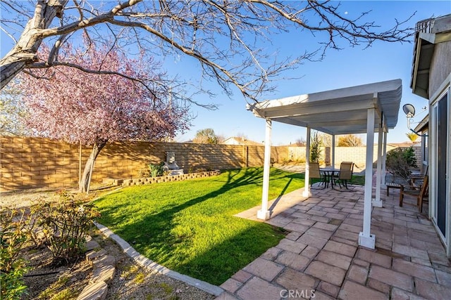 view of yard featuring a patio and a fenced backyard