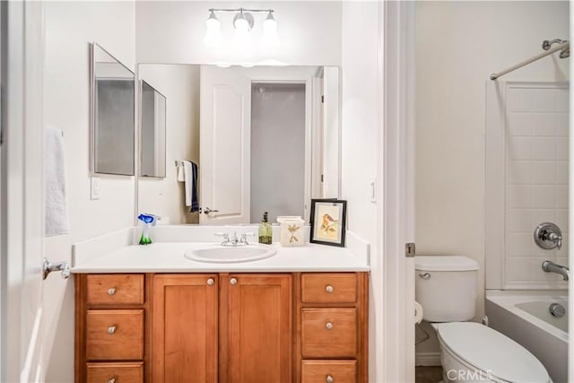 bathroom with vanity, toilet, and washtub / shower combination