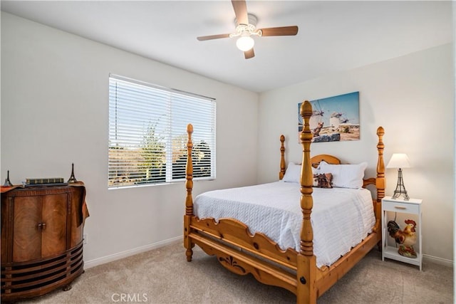 carpeted bedroom featuring a ceiling fan and baseboards