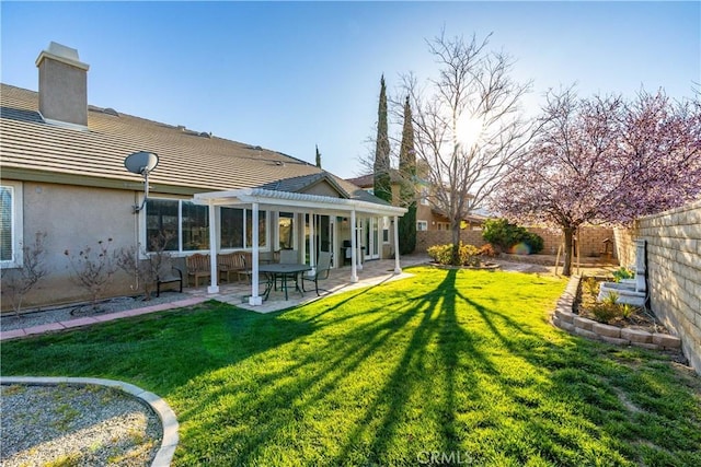 view of yard featuring a patio area, a pergola, and a fenced backyard