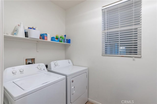 laundry area featuring laundry area, baseboards, and independent washer and dryer