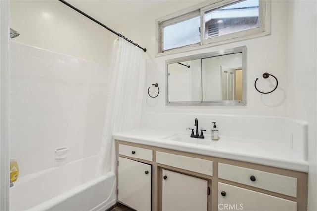 full bath featuring shower / bath combo with shower curtain and vanity