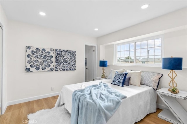 bedroom featuring recessed lighting, baseboards, and light wood-style floors