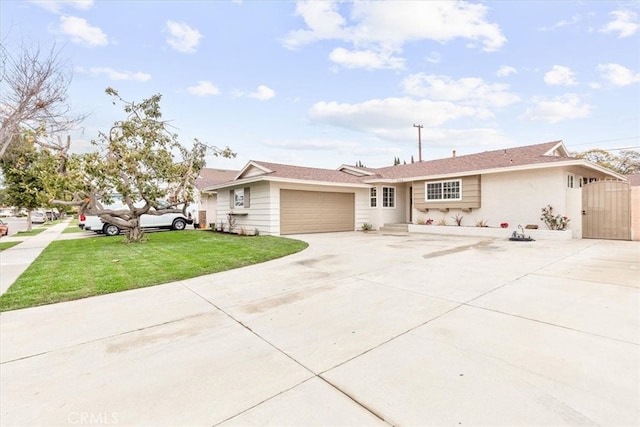 single story home featuring stucco siding, driveway, a front lawn, a gate, and an attached garage