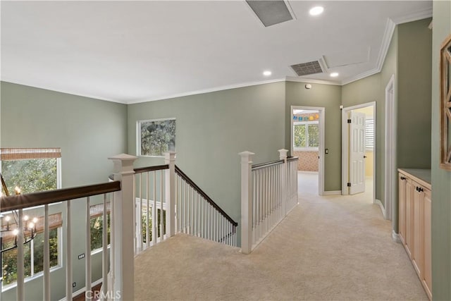 hallway with visible vents, recessed lighting, ornamental molding, light carpet, and an upstairs landing