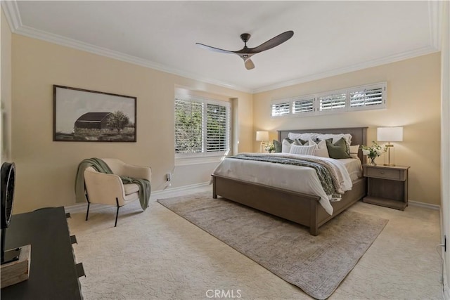 bedroom with baseboards, light carpet, ornamental molding, and a ceiling fan