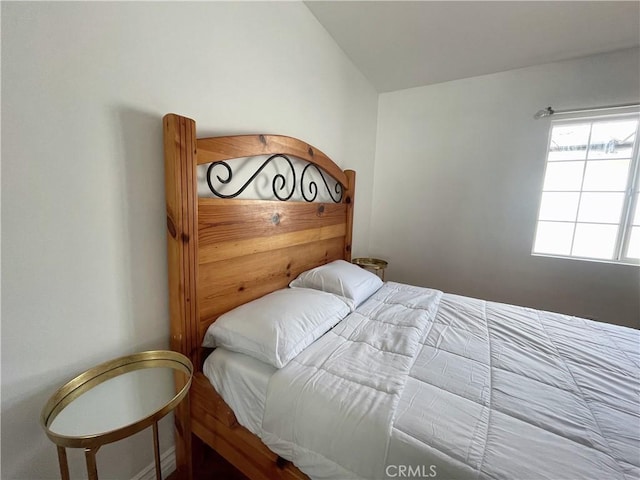 bedroom with vaulted ceiling