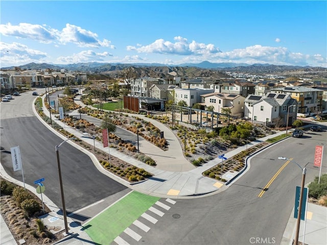 drone / aerial view featuring a mountain view and a residential view