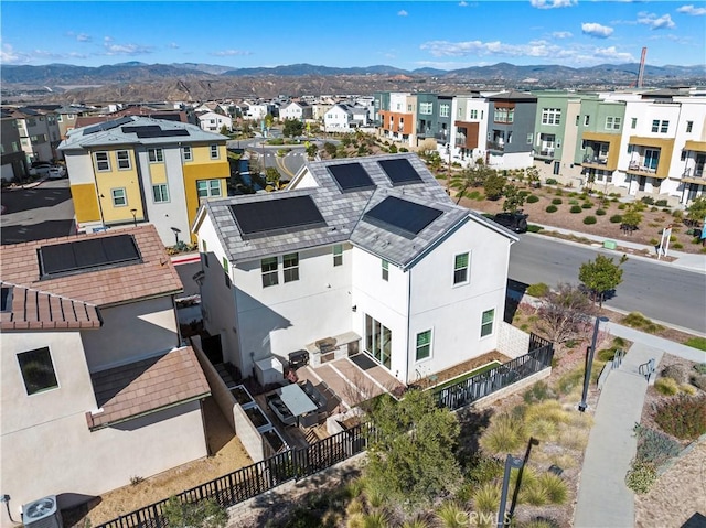 drone / aerial view with a mountain view and a residential view