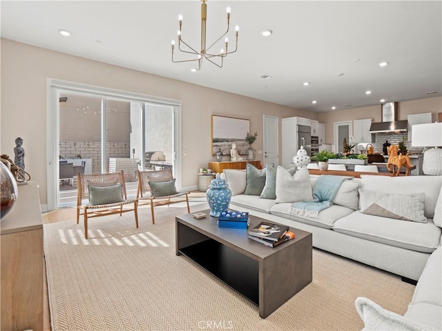 living area featuring a chandelier, recessed lighting, light wood-style flooring, and baseboards