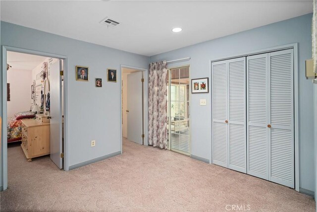 carpeted bedroom featuring recessed lighting, visible vents, and baseboards