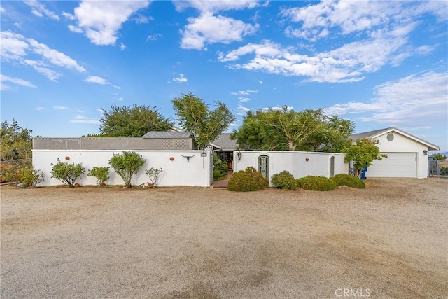 view of yard with a fenced front yard and an attached garage