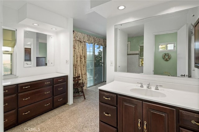 bathroom with vanity and recessed lighting