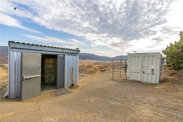 view of shed with a mountain view