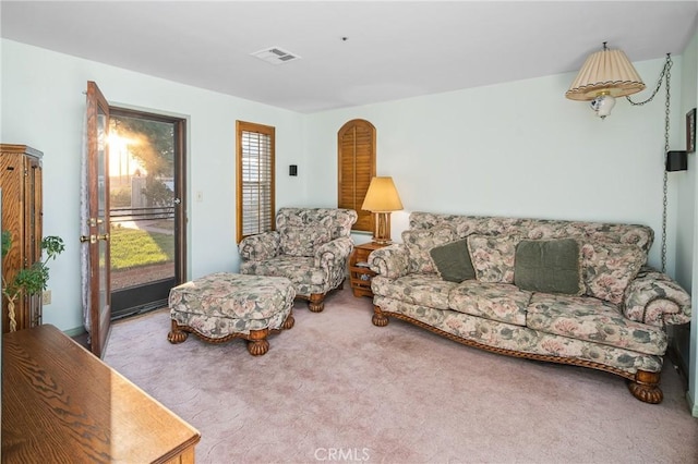 living room with carpet flooring and visible vents