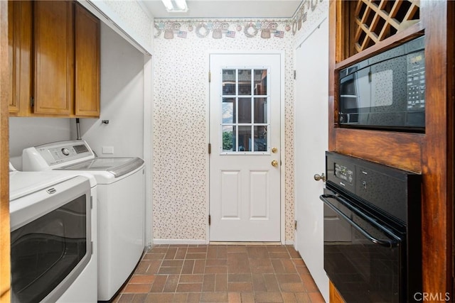 laundry room with washer and clothes dryer, wallpapered walls, and brick floor