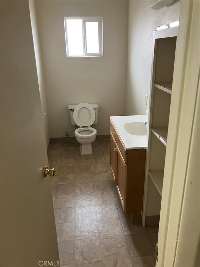 bathroom with toilet and vanity