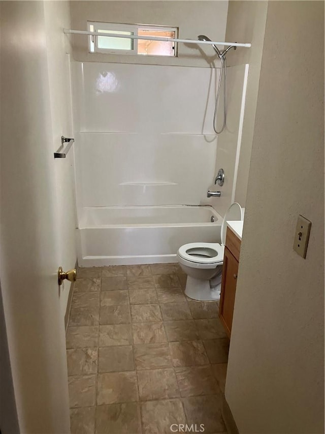 full bath with vanity, toilet, and shower / washtub combination