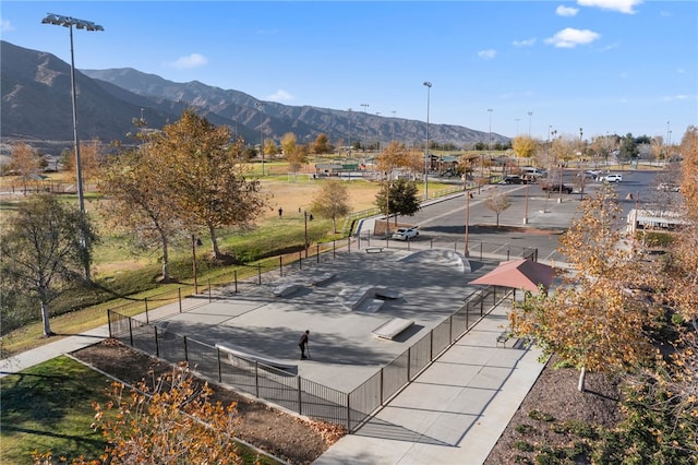 exterior space with fence and a mountain view