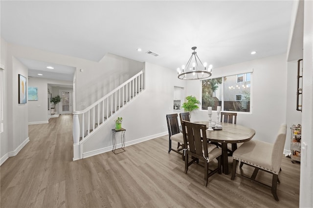 dining space featuring stairs, light wood-style flooring, recessed lighting, and visible vents