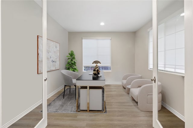 office space with recessed lighting, baseboards, and light wood finished floors