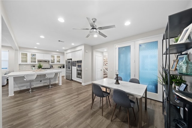 dining space featuring a ceiling fan, recessed lighting, wood finished floors, and visible vents