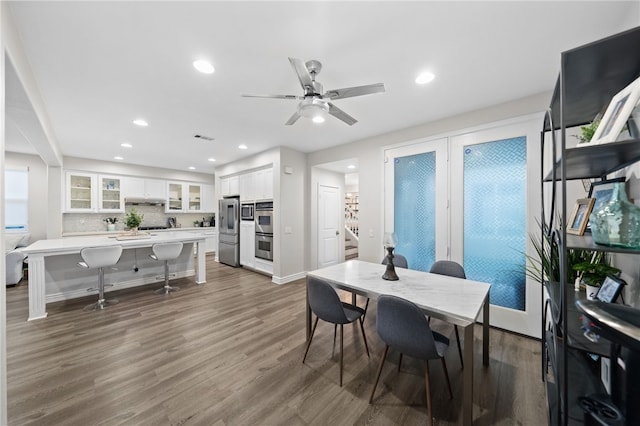 11119 Iris Ct, Corona, CA 92883 - dining room with wood finished floors, recessed lighting, a ceiling fan, and stairway