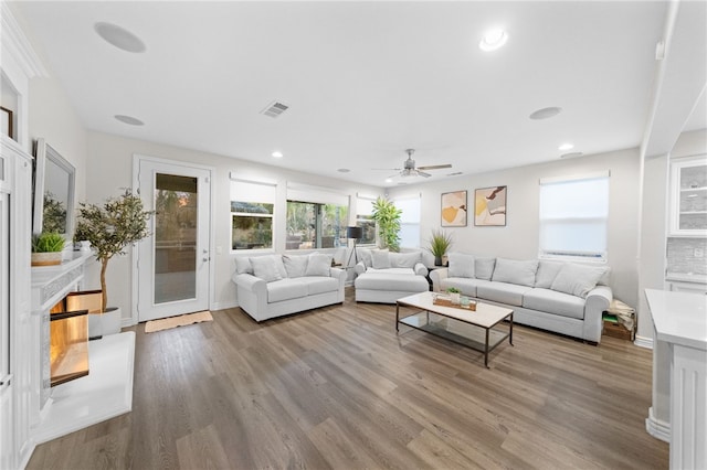 11119 Iris Ct, Corona, CA 92883 - living room featuring wood finished floors, ceiling fan, and recessed lighting