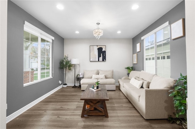 living room featuring recessed lighting, wood finished floors, and baseboards