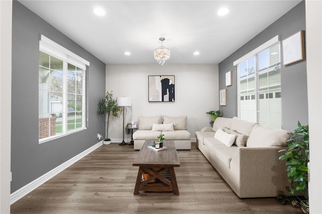 11119 Iris Ct, Corona, CA 92883 - living area with plenty of natural light, recessed lighting, wood finished floors, and a chandelier
