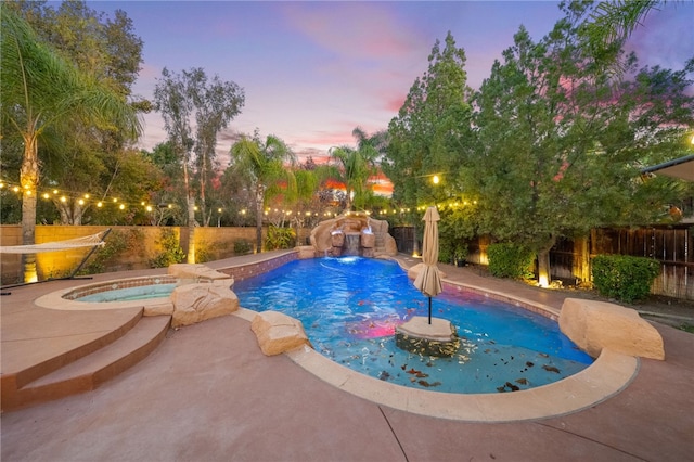 view of swimming pool with a patio area, a fenced in pool, an in ground hot tub, and a fenced backyard