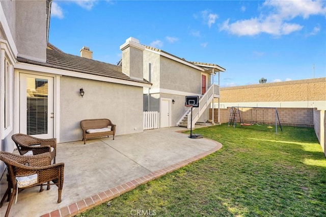 exterior space featuring stairway and a fenced backyard