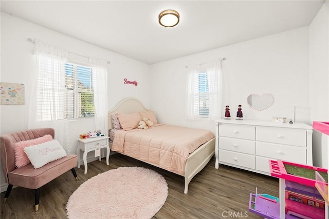 bedroom featuring wood finished floors