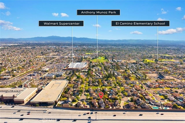 birds eye view of property featuring a mountain view