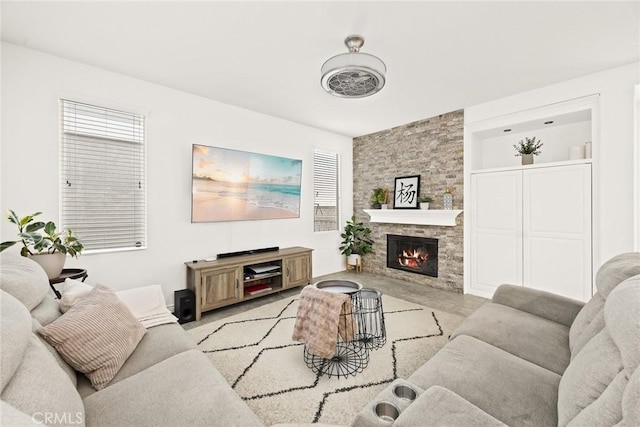 living area featuring a stone fireplace