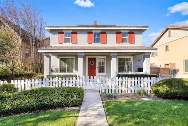 view of front facade featuring stucco siding, covered porch, a fenced front yard, and a chimney