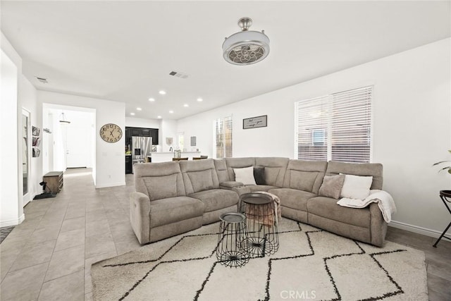 living room with recessed lighting, visible vents, baseboards, and light tile patterned flooring