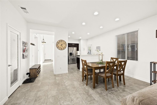 dining space with recessed lighting, visible vents, and baseboards