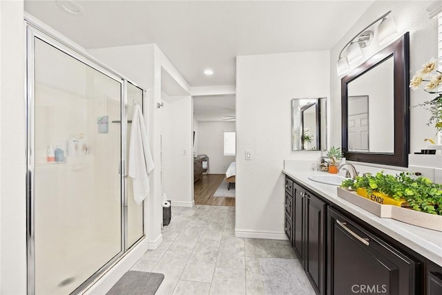 ensuite bathroom with ensuite bath, recessed lighting, a shower stall, and vanity