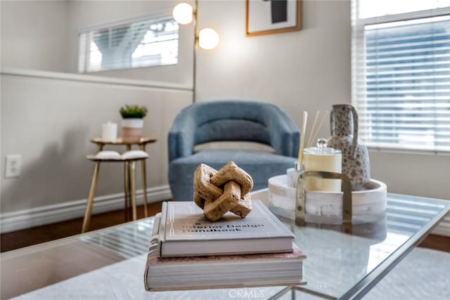 living area featuring baseboards