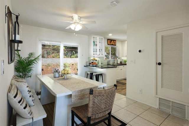 dining room with light tile patterned floors, baseboards, visible vents, recessed lighting, and ceiling fan