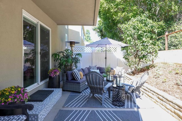 view of patio / terrace with an outdoor hangout area and a fenced backyard